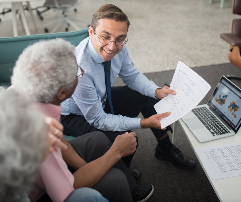 Older Couple reviewing retirement plan with home equity advisor